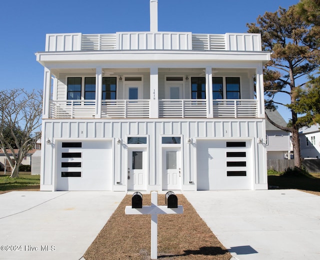 view of front of home featuring a garage and a balcony