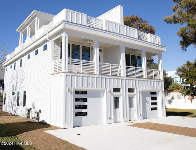 view of front of home with a balcony and a garage