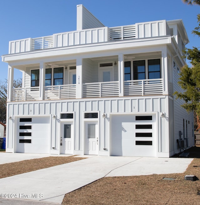 modern home with a garage and a balcony