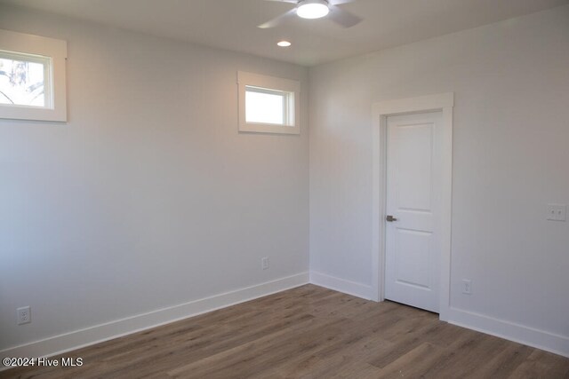 empty room featuring hardwood / wood-style floors and ceiling fan