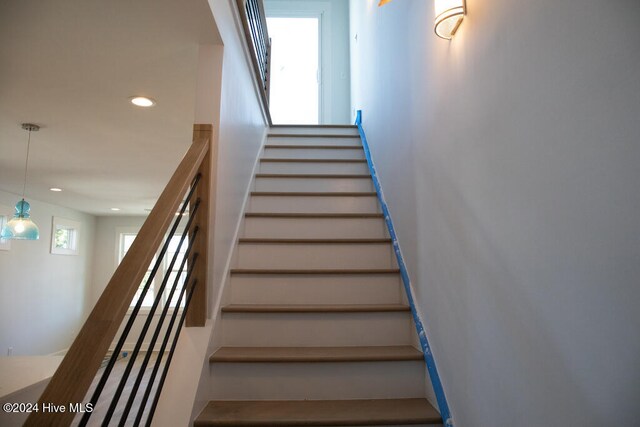 staircase featuring plenty of natural light