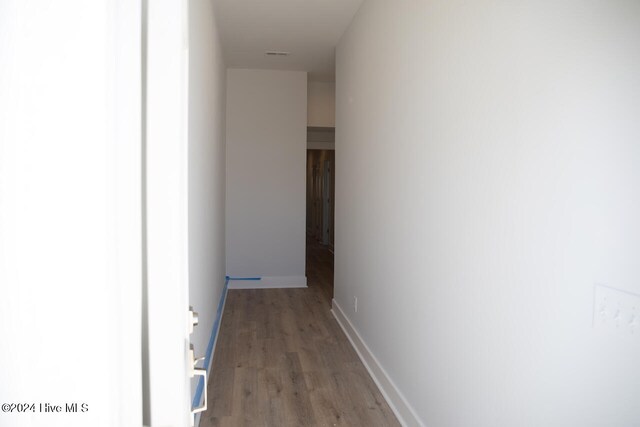 hallway featuring wood-type flooring