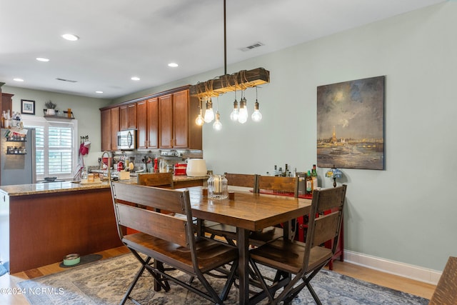 dining room with hardwood / wood-style floors