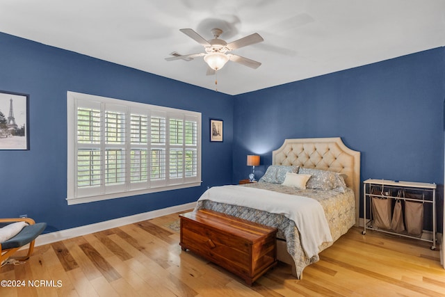 bedroom with ceiling fan and light hardwood / wood-style flooring