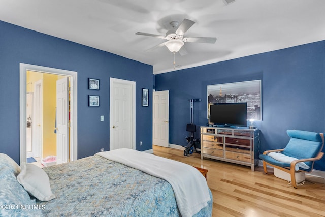 bedroom with ceiling fan and wood-type flooring