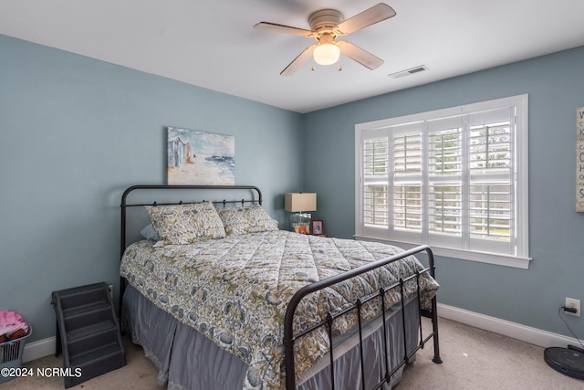 carpeted bedroom with ceiling fan