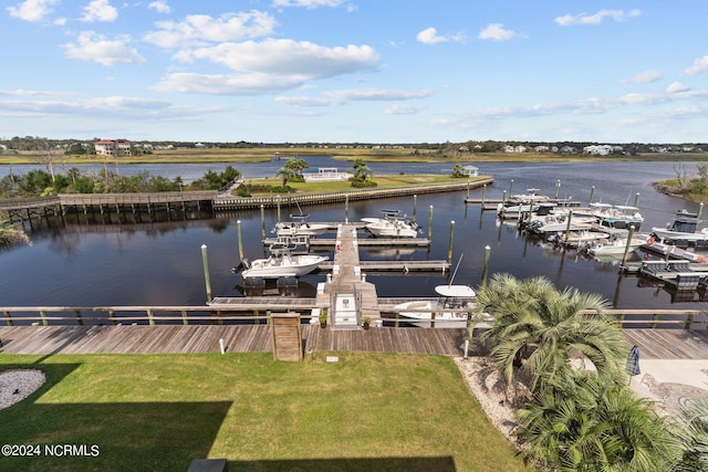 view of dock featuring a lawn and a water view