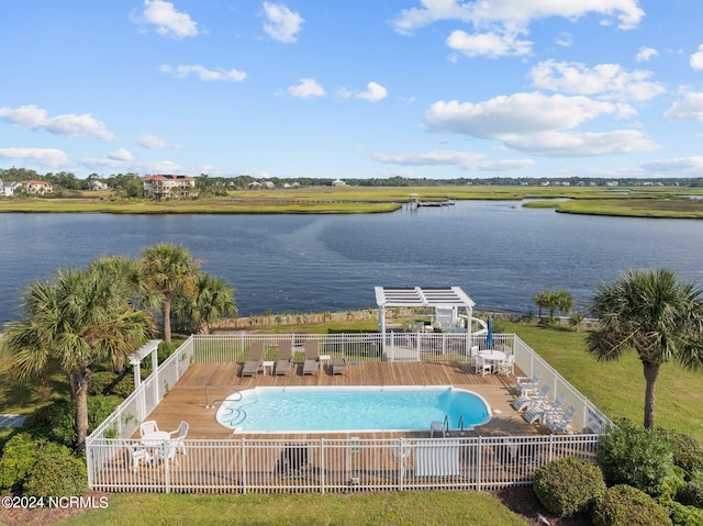 view of pool with a water view and a patio area