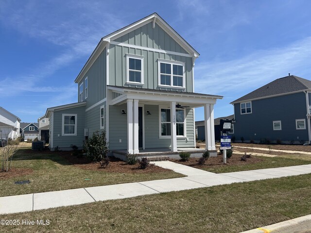 view of front of home featuring a front yard and covered porch