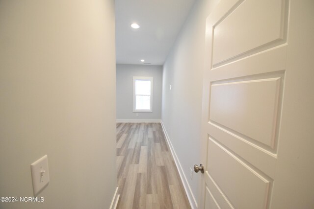 hall with light wood-type flooring