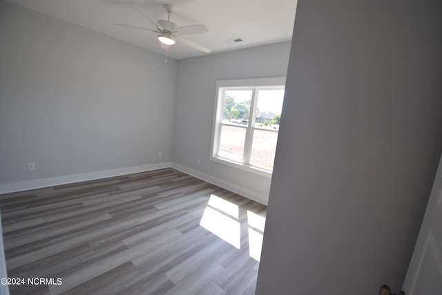 unfurnished room featuring ceiling fan and light wood-type flooring