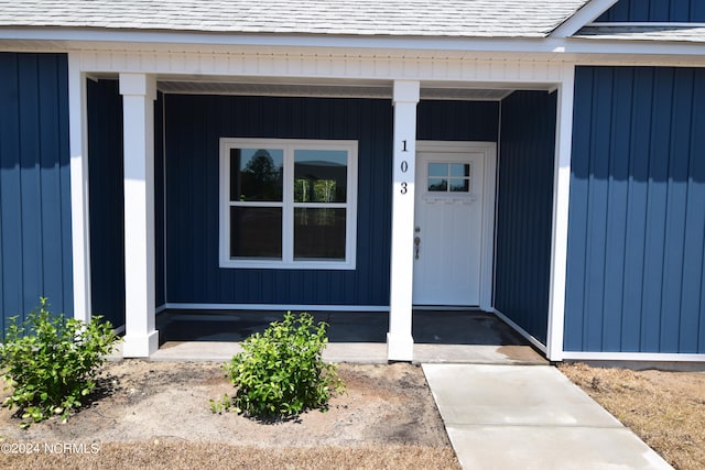 doorway to property featuring a porch