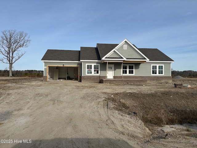 view of front of property featuring a carport