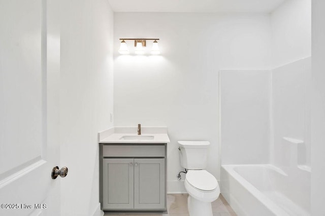 bathroom featuring toilet and vanity