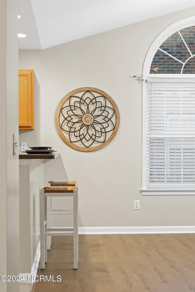 empty room with dark hardwood / wood-style floors, ceiling fan, and lofted ceiling