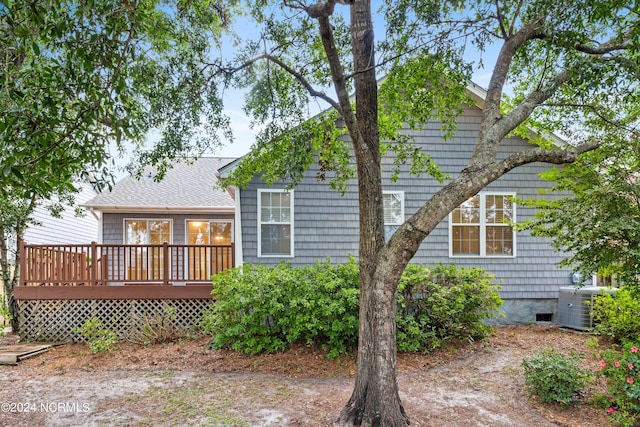rear view of property featuring a deck, central AC, and crawl space