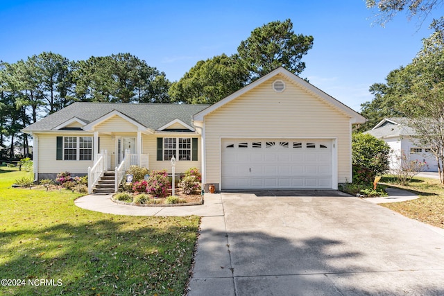 ranch-style house featuring a garage and a front lawn