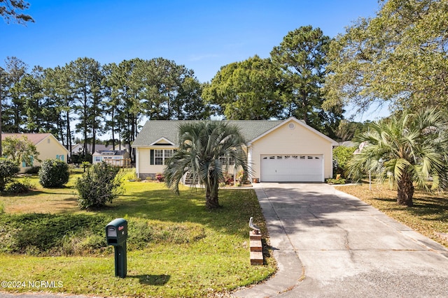 ranch-style home featuring a garage and a front lawn