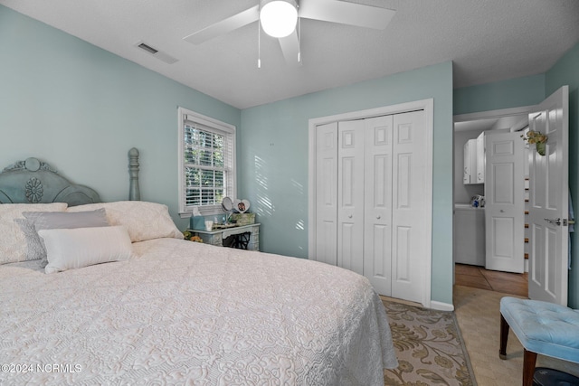 bedroom featuring ceiling fan, a textured ceiling, and a closet