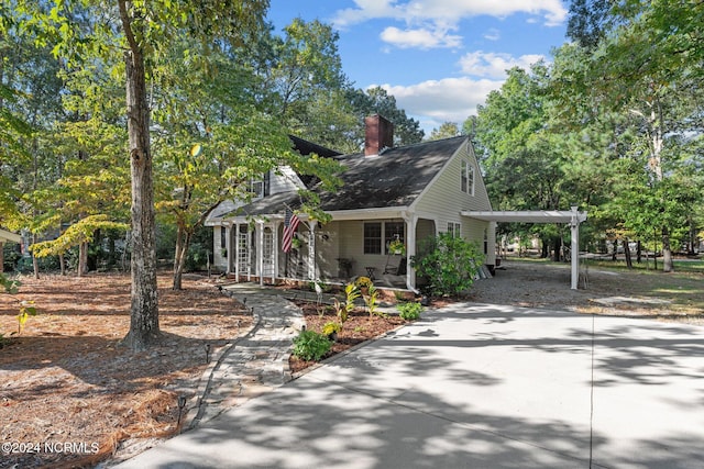 view of front of home with a carport and covered porch