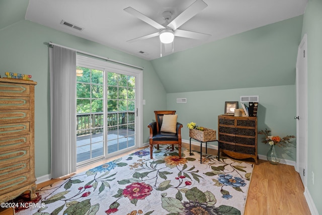 sitting room with ceiling fan, lofted ceiling, and light hardwood / wood-style flooring