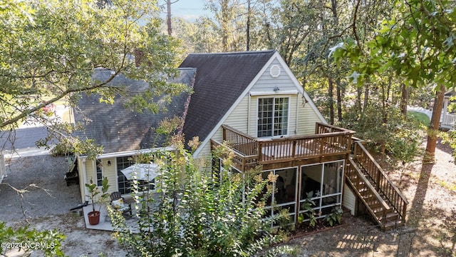 back of house featuring a deck