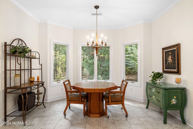 dining area featuring crown molding and a notable chandelier