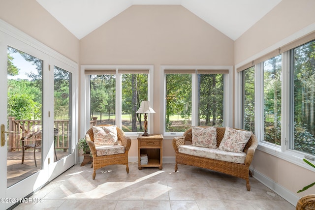 sunroom / solarium featuring vaulted ceiling