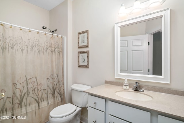 full bathroom featuring vanity, shower / tub combo, and toilet