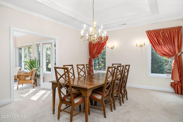 carpeted dining space with a raised ceiling, a wealth of natural light, and ornamental molding