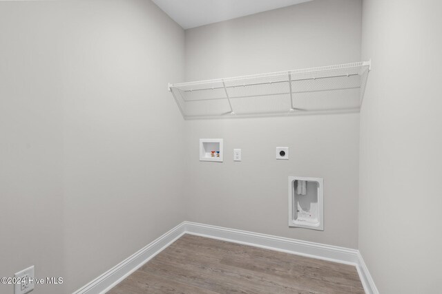 laundry area featuring hookup for a washing machine, hardwood / wood-style flooring, and electric dryer hookup