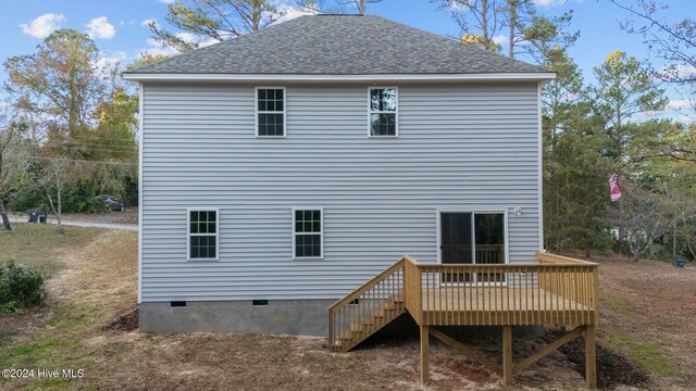 rear view of property with a deck