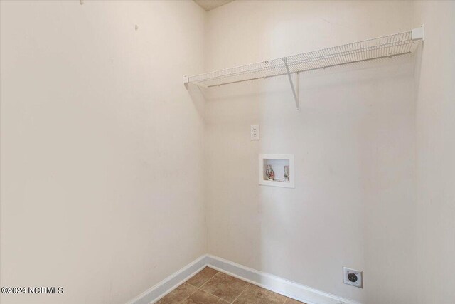 laundry room with tile patterned floors, electric dryer hookup, and hookup for a washing machine