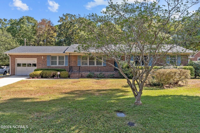 ranch-style home with a front lawn and a garage