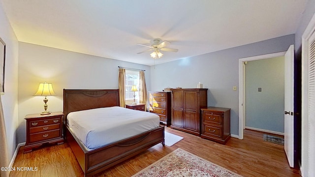 bedroom featuring wood-type flooring and ceiling fan