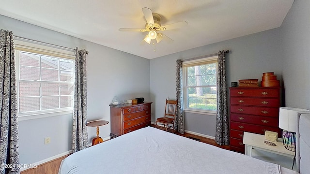 bedroom featuring hardwood / wood-style flooring and ceiling fan