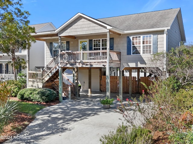 beach home with a carport and a porch