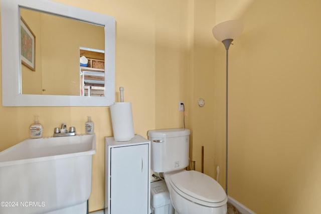 bathroom with toilet and sink