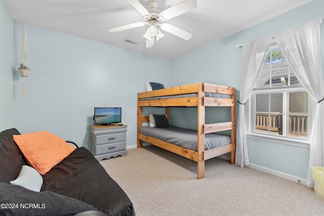 bedroom with ceiling fan and light colored carpet