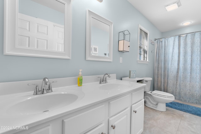 bathroom with curtained shower, vanity, toilet, and tile patterned floors