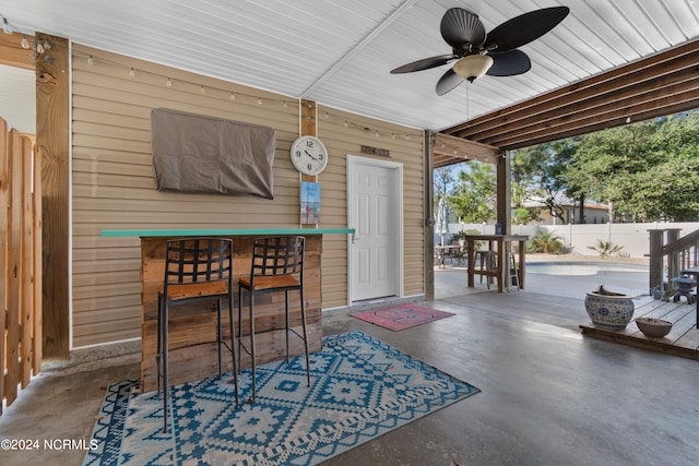 view of patio featuring ceiling fan