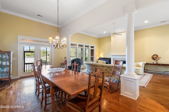 dining area featuring french doors, ornamental molding, ceiling fan with notable chandelier, and hardwood / wood-style floors