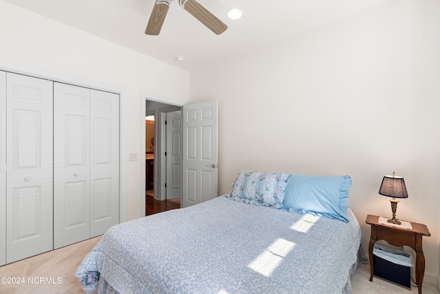 carpeted bedroom with a closet and ceiling fan