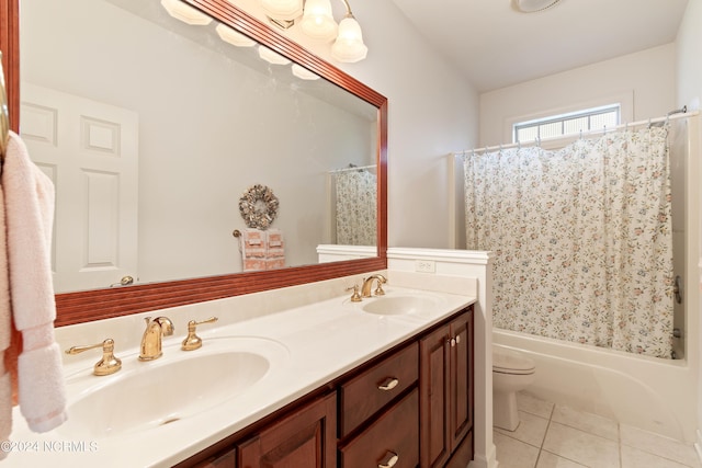 full bathroom featuring toilet, shower / bath combo, vanity, and tile patterned flooring