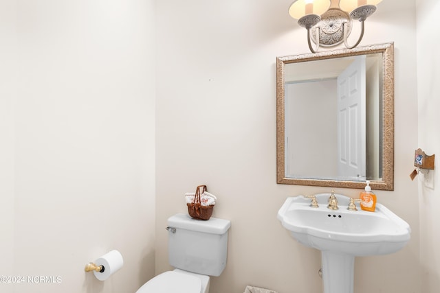 bathroom with sink and toilet