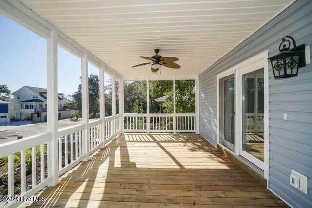 deck featuring covered porch and a ceiling fan