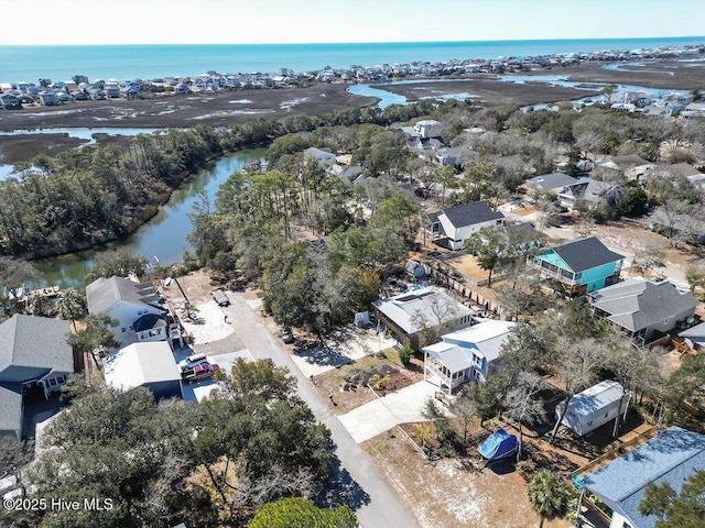 drone / aerial view featuring a water view and a residential view