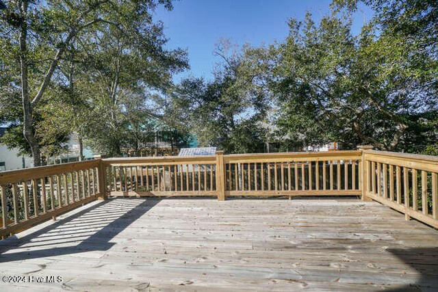 deck featuring a shed