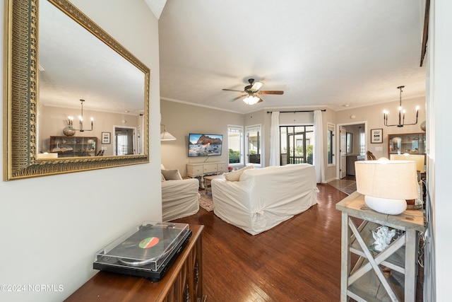 living room with ceiling fan with notable chandelier, crown molding, and hardwood / wood-style flooring