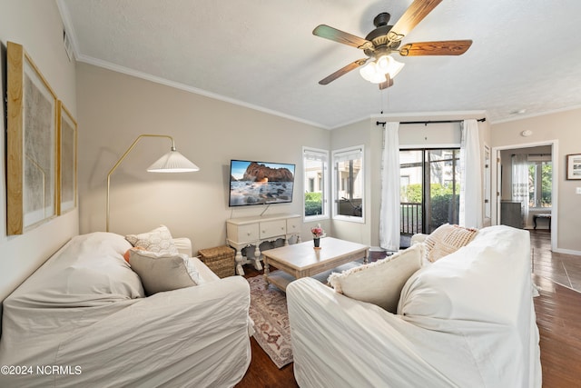 living room featuring a textured ceiling, ceiling fan, crown molding, and dark hardwood / wood-style flooring